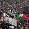 Ayatollah Weeps And Iranians Rail Against U.S. During Funeral For Slain Commander