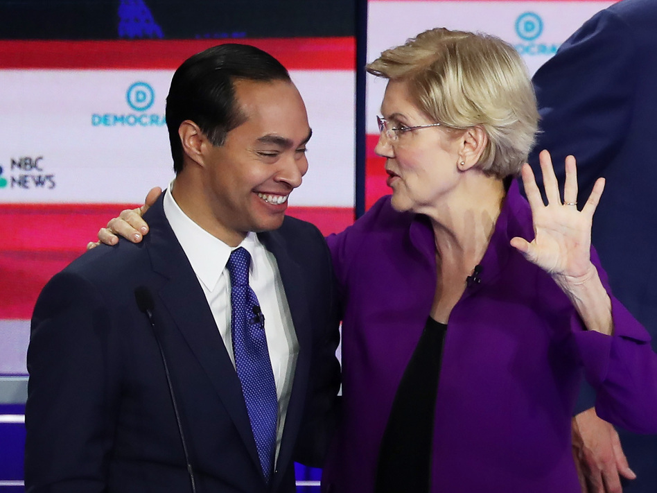 Former Housing Secretary Julián Castro and Massachusetts Sen. Elizabeth Warren embrace after a Democratic presidential debate on June 26 in Miami. (Joe Raedle/Getty Images)
