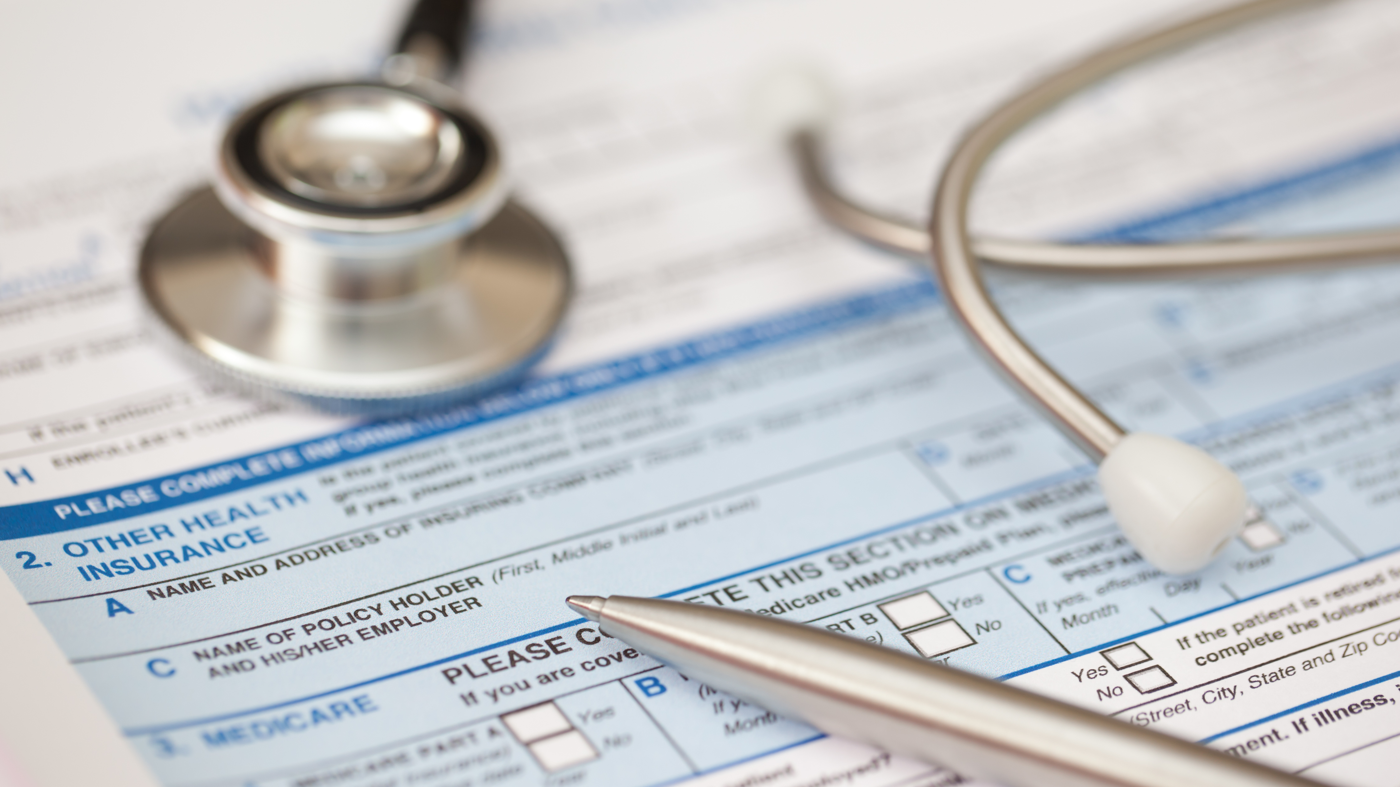 Patient health record form with stethoscope (Getty Images)