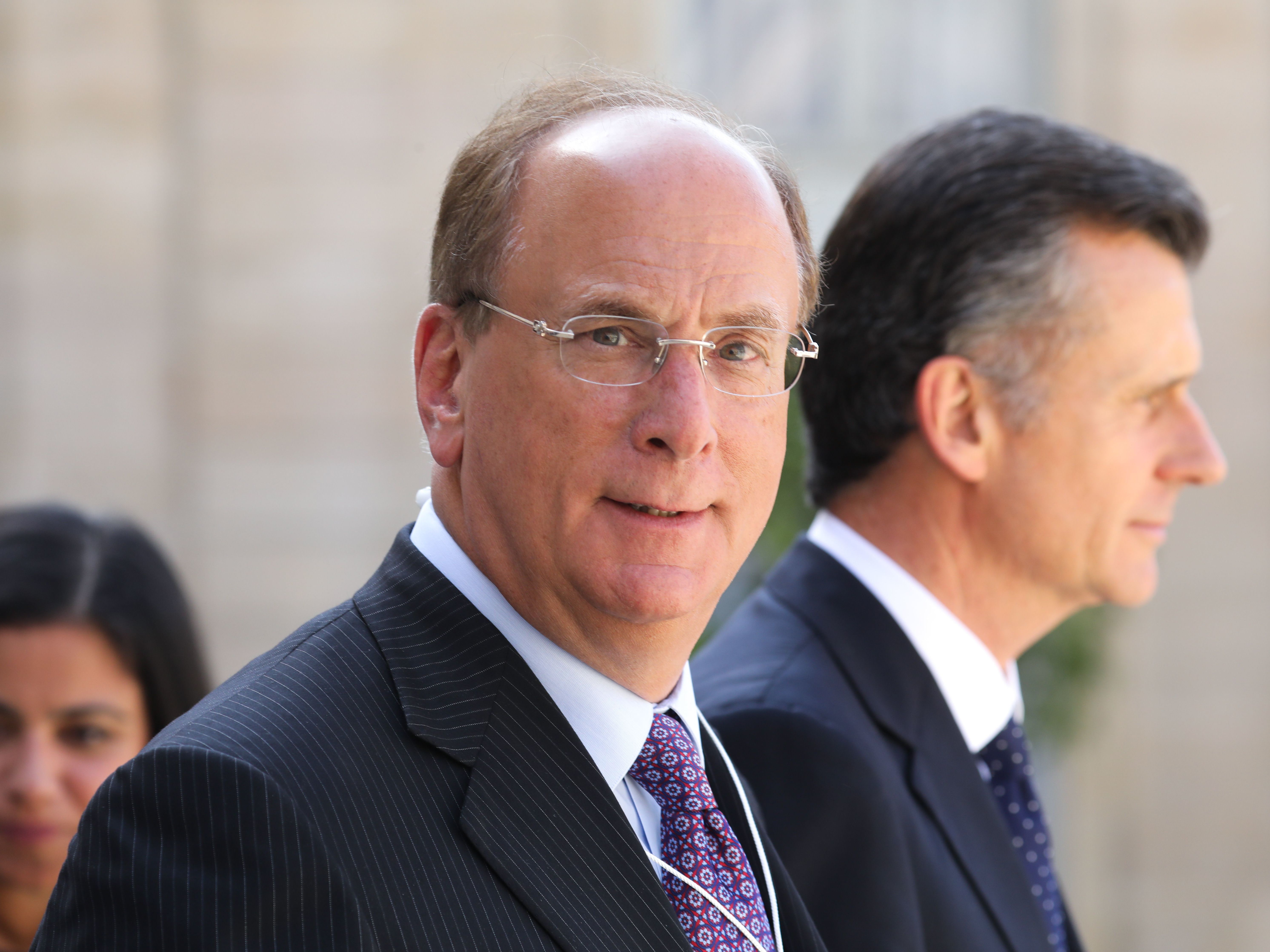 BlackRock Chairman and CEO Larry Fink, seen here in Paris in July, wrote in his annual letter to CEOs that climate change will soon cause &quot;a significant reallocation of capital.&quot; (AFP via Getty Images)