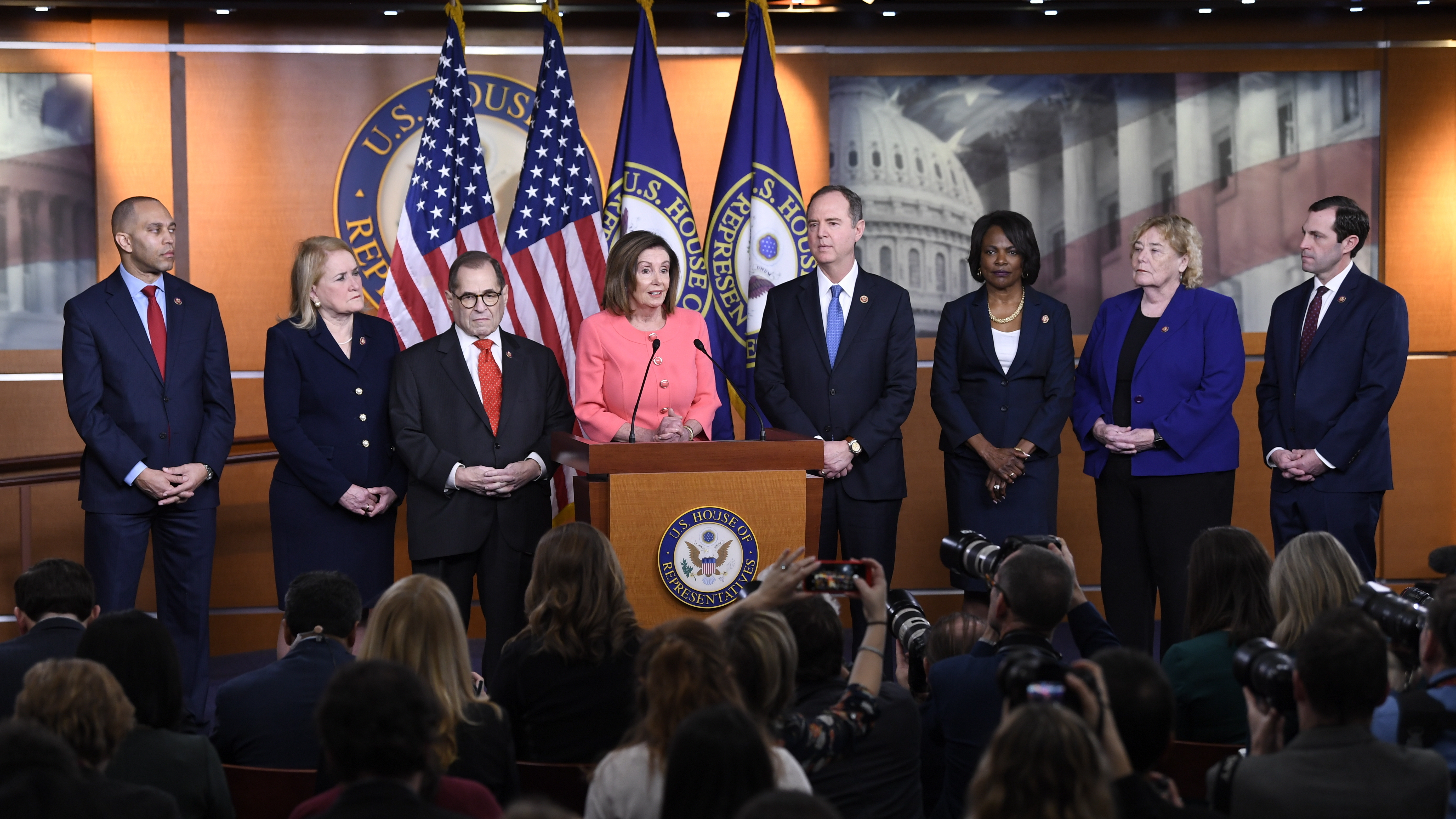 House Speaker Nancy Pelosi of California announces the seven impeachment managers — (flanking Pelosi from left) Hakeem Jeffries, Sylvia Garcia, Jerry Nadler, Adam Schiff, Val Demings, Zoe Lofgren Jason Crow — on Capitol Hill on Wednesday.