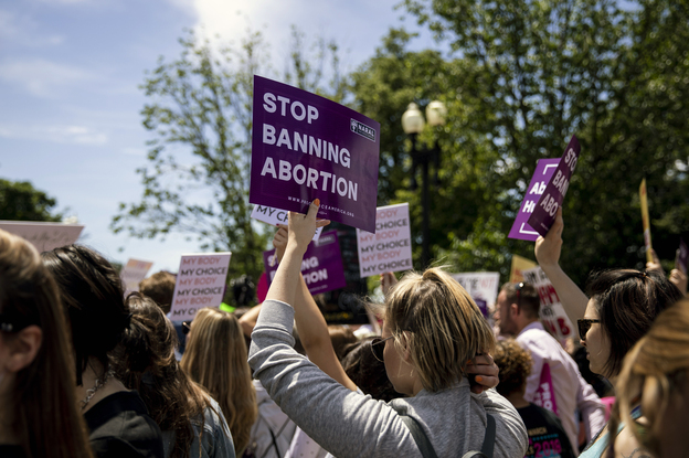 Pro-choice activists made their case at a demonstration last May in front of the U.S. Supreme Court in Washington. A high court decision in a case that could curtail or even overturn <em>Roe v. Wade</em> is set for opening arguments in March. (Anna Moneymaker/Bloomberg via Getty Images)