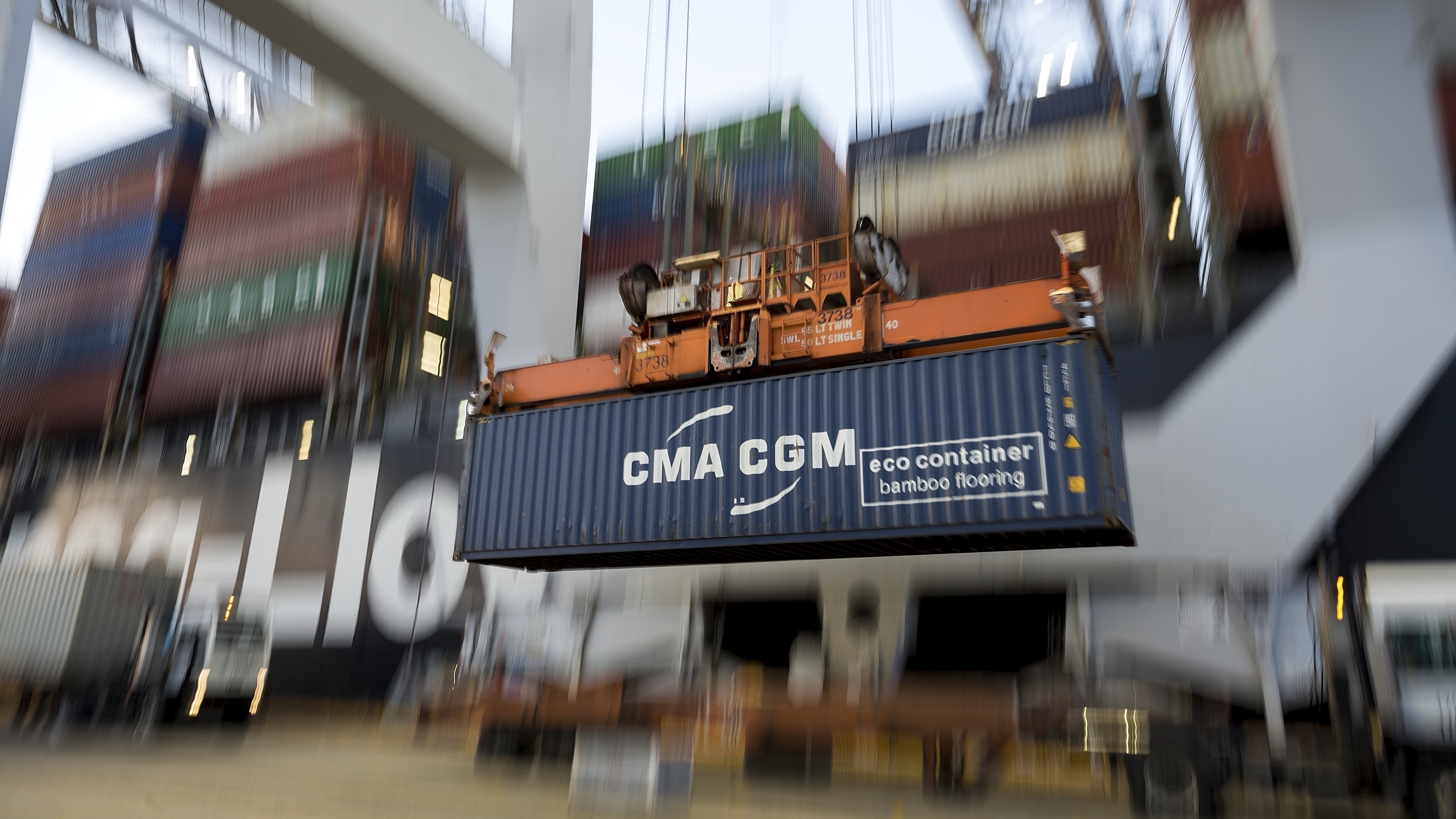 A crane lifts a CMA CGM Group shipping container from China onto the Hapag-Lloyd Terminal at the Port of Savannah in Savannah, Ga. China