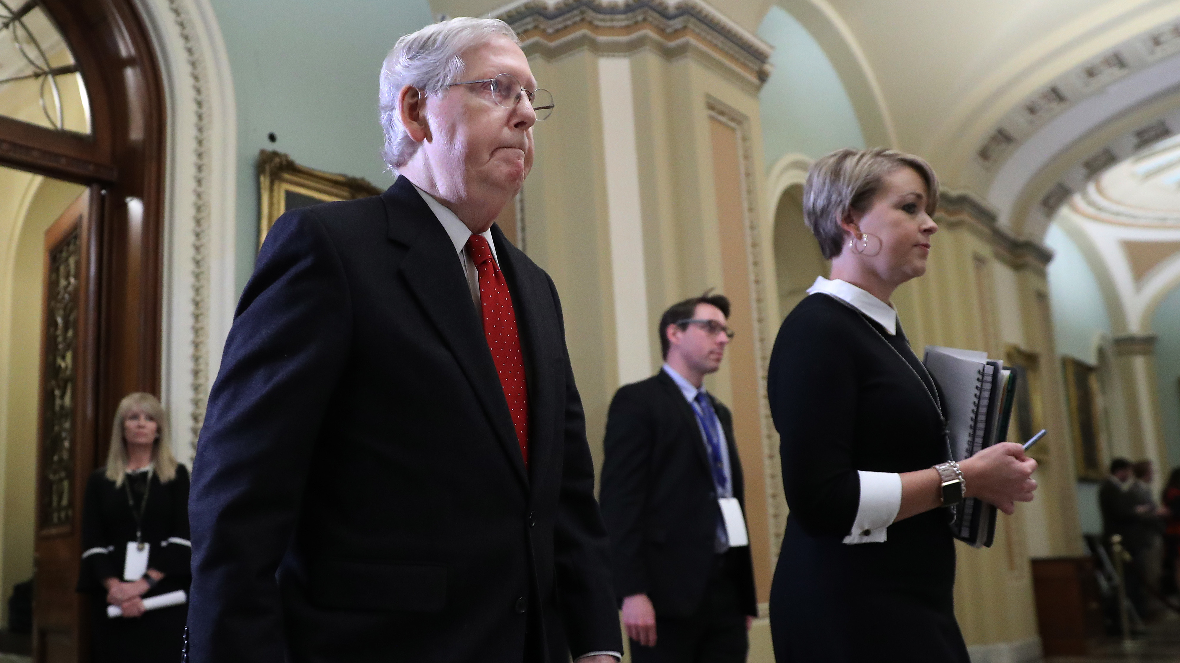 Senate Majority Leader Mitch McConnell, R-Ky., walks out of the Senate Chamber before the start of President Trump's impeachment trial on Tuesday. (Getty Images)