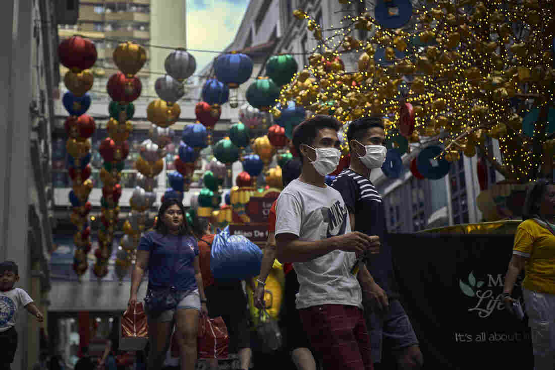 Shoppers wearing face masks for protection in Chinatown on January 23, 2020 in Manila, Philippines.