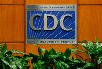 A podium with the logo for the Centers for Disease Control and Prevention at the Tom Harkin Global Communications Center in Atlanta.