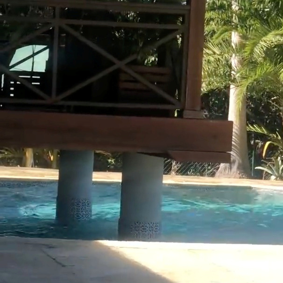 Waves splash in a pool during an earthquake in the Cayman Islands. Social media was flooded with photos and video from people documenting the event. (Realvision.com via Reuters)