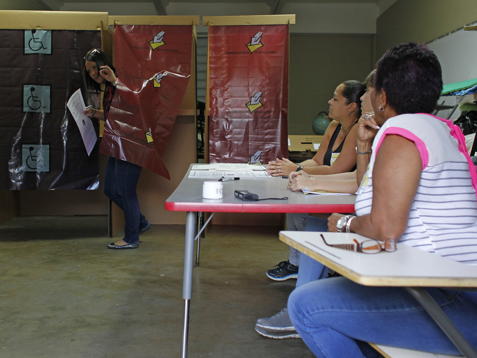 The ACLU is urging Puerto Rico's governor to veto a plan to introduce online voting on the island, warning it increases risks of election tampering. (Ricardo Arduengo/AFP via Getty Images)