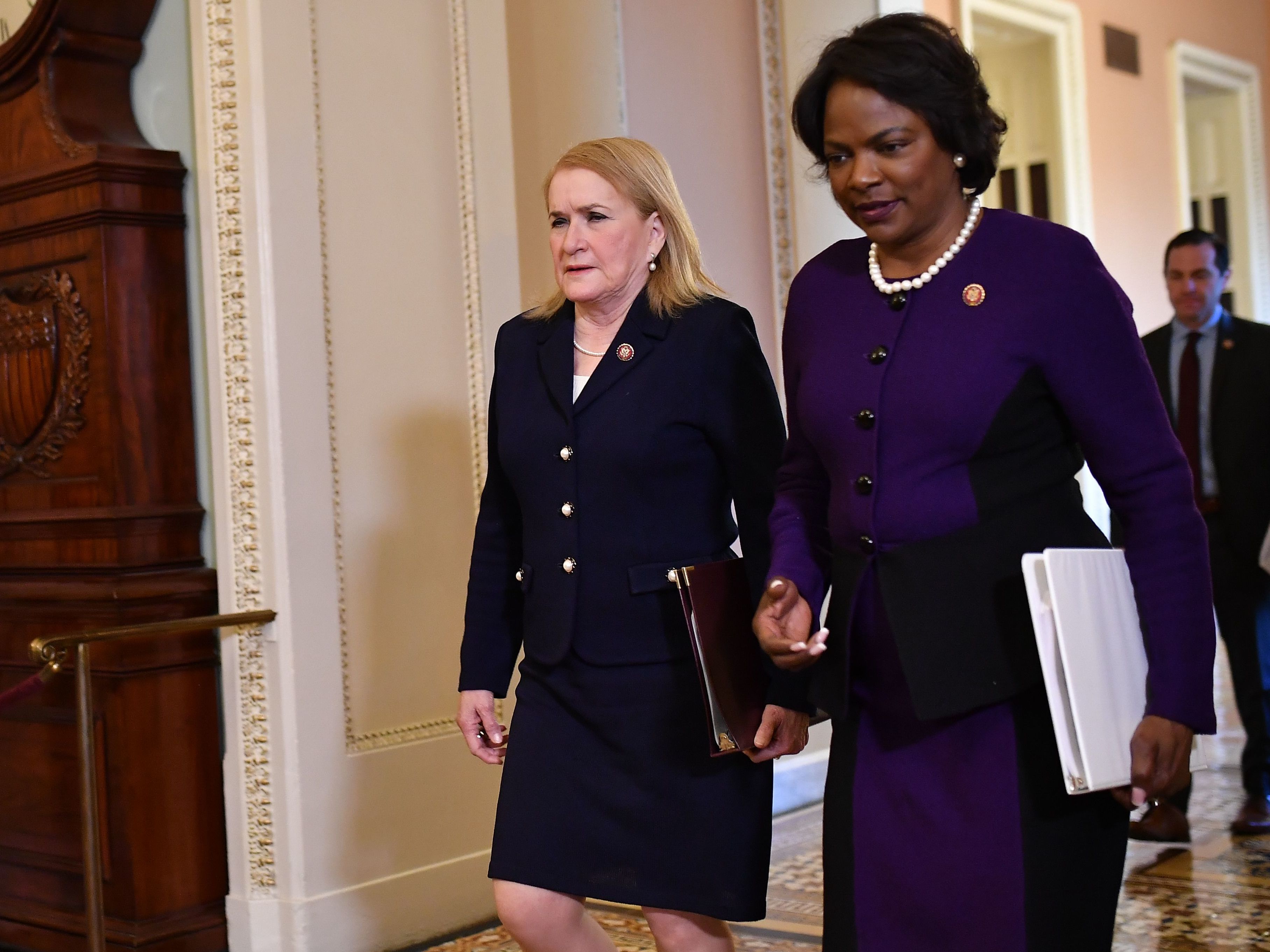 House impeachment managers Reps. Val Demings, right, and Sylvia Garcia arrive for closing statements in President Trump's impeachment trial.