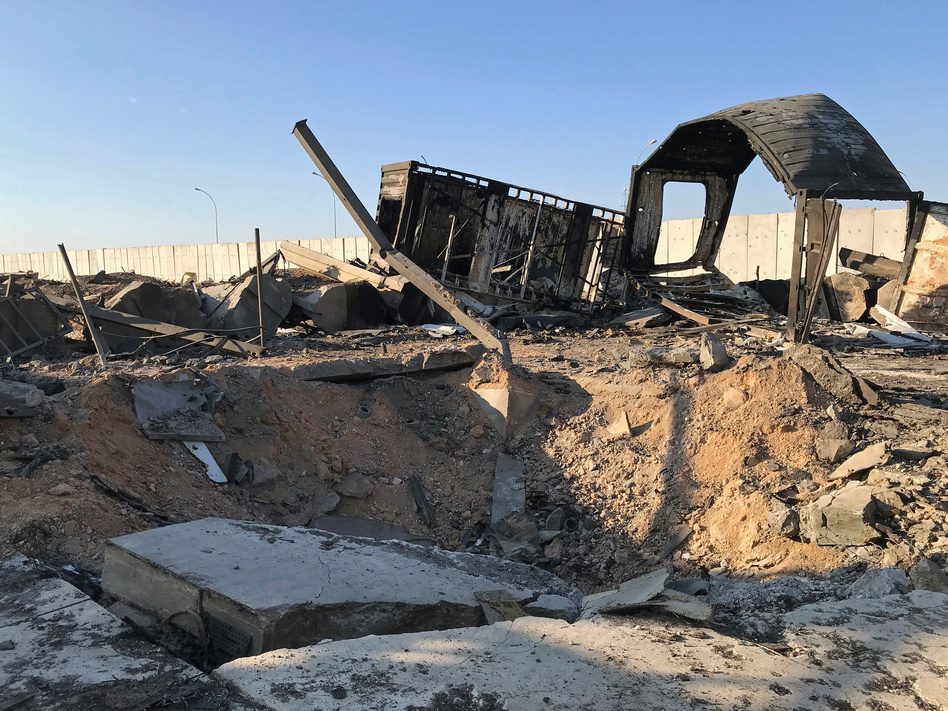 Debris and rubble are seen at the site where an Iranian missile struck Ain al-Asad air base in Iraq's Anbar province in January. The U.S. has repeatedly raised its injury report from the strike; it now says 109 personnel suffered brain injuries. (John Davison/Reuters)