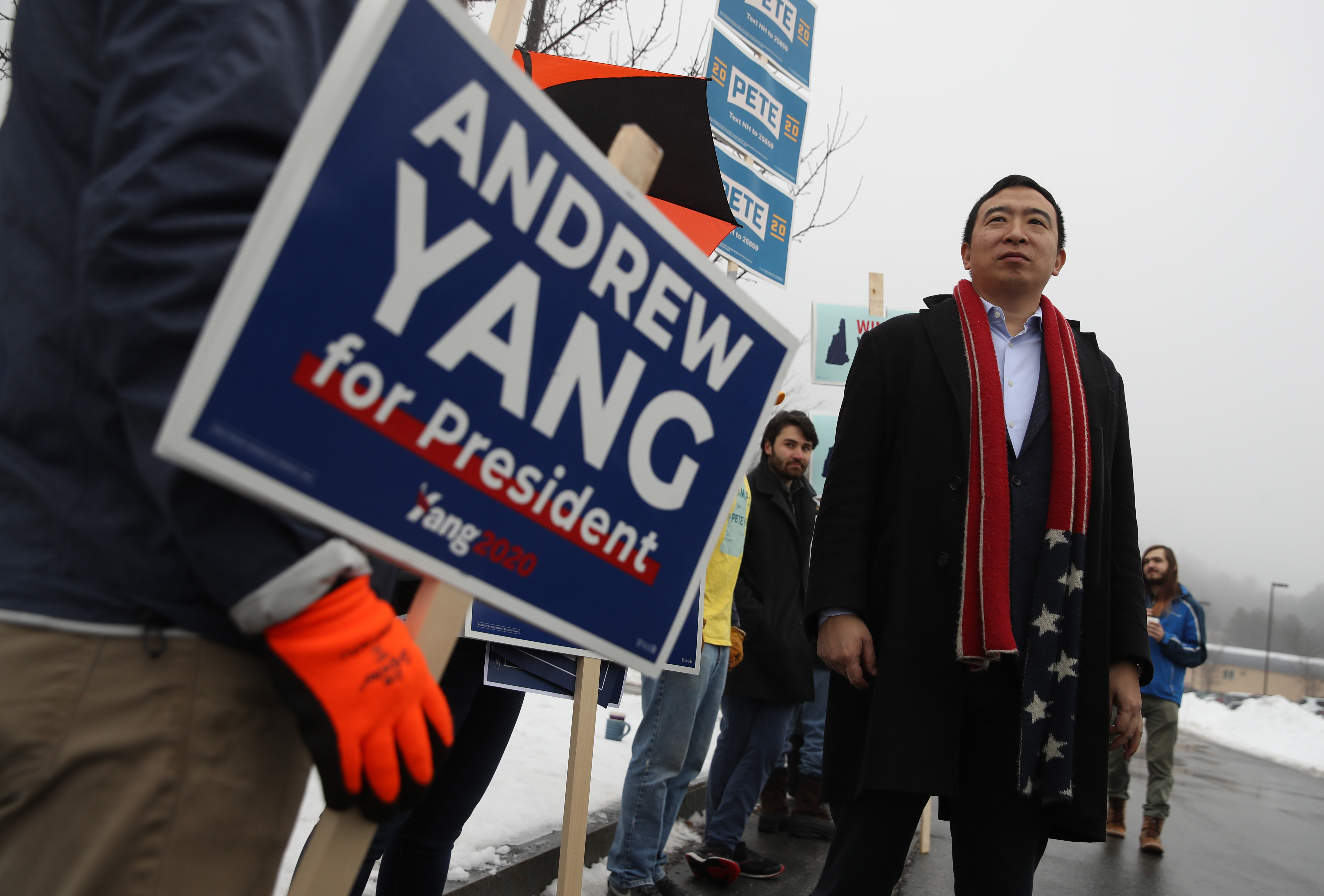 Democratic presidential candidate Andrew Yang greets supporters in front of a polling station on Feb. 11 in Keene, N.H. (Getty Images)