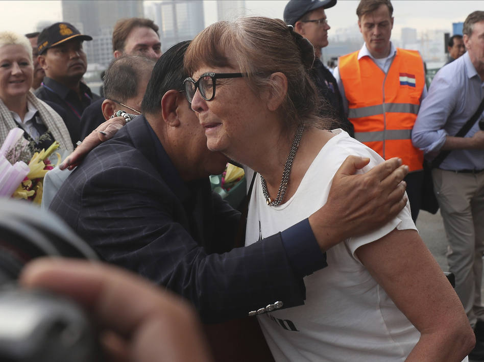 A passenger (right) is hugged by Cambodia Prime Minister Hun Sen after she disembarked from the MS Westerdam at the port of Sihanoukville, Cambodia, on Friday. (Heng Sinith/AP)