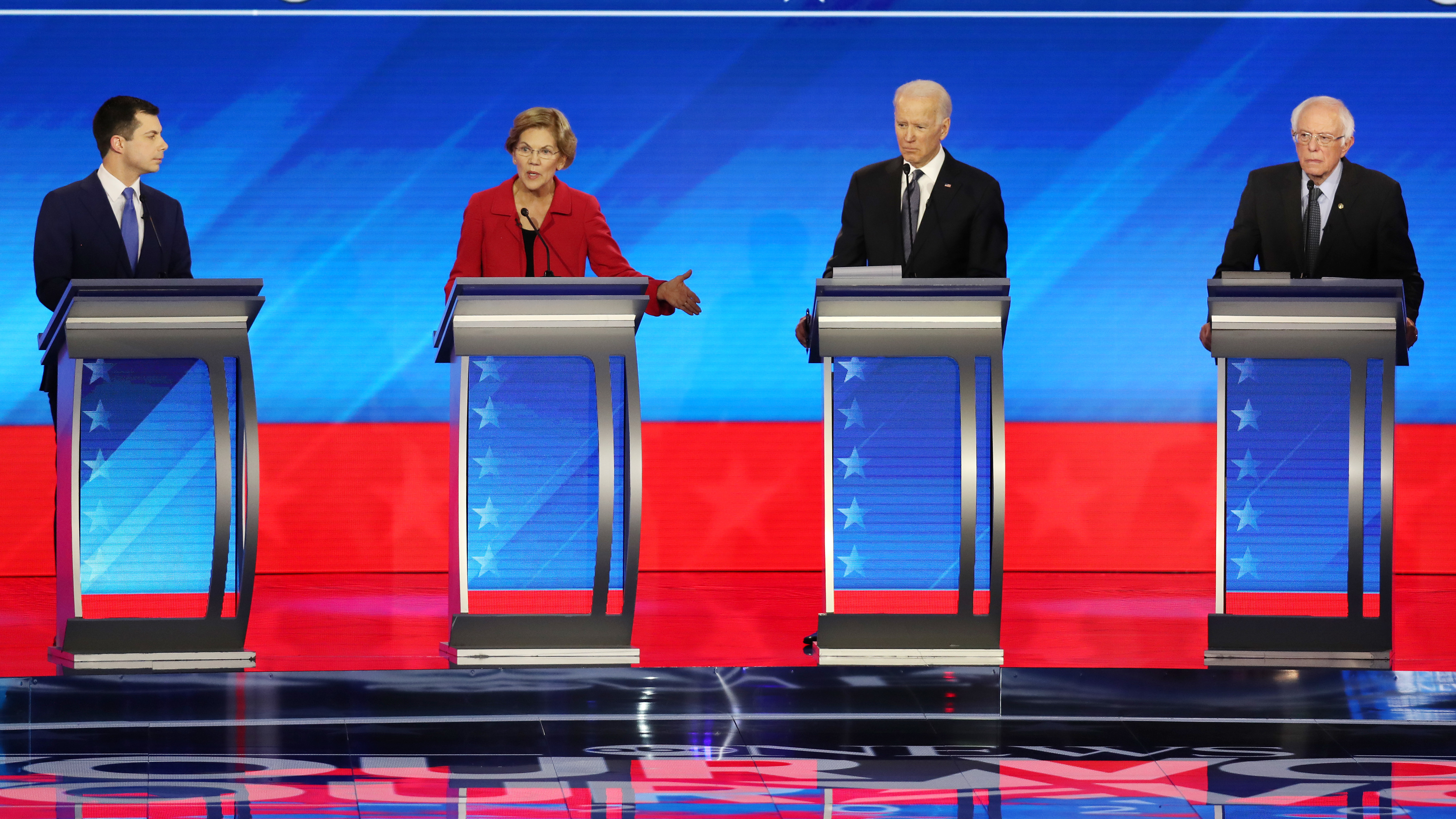 Amy Klobuchar and Michael Bloomberg join these four candidates — Pete Buttigieg (left), Elizabeth Warren, Joe Biden and Bernie Sanders — onstage Wednesday night. (Getty Images)
