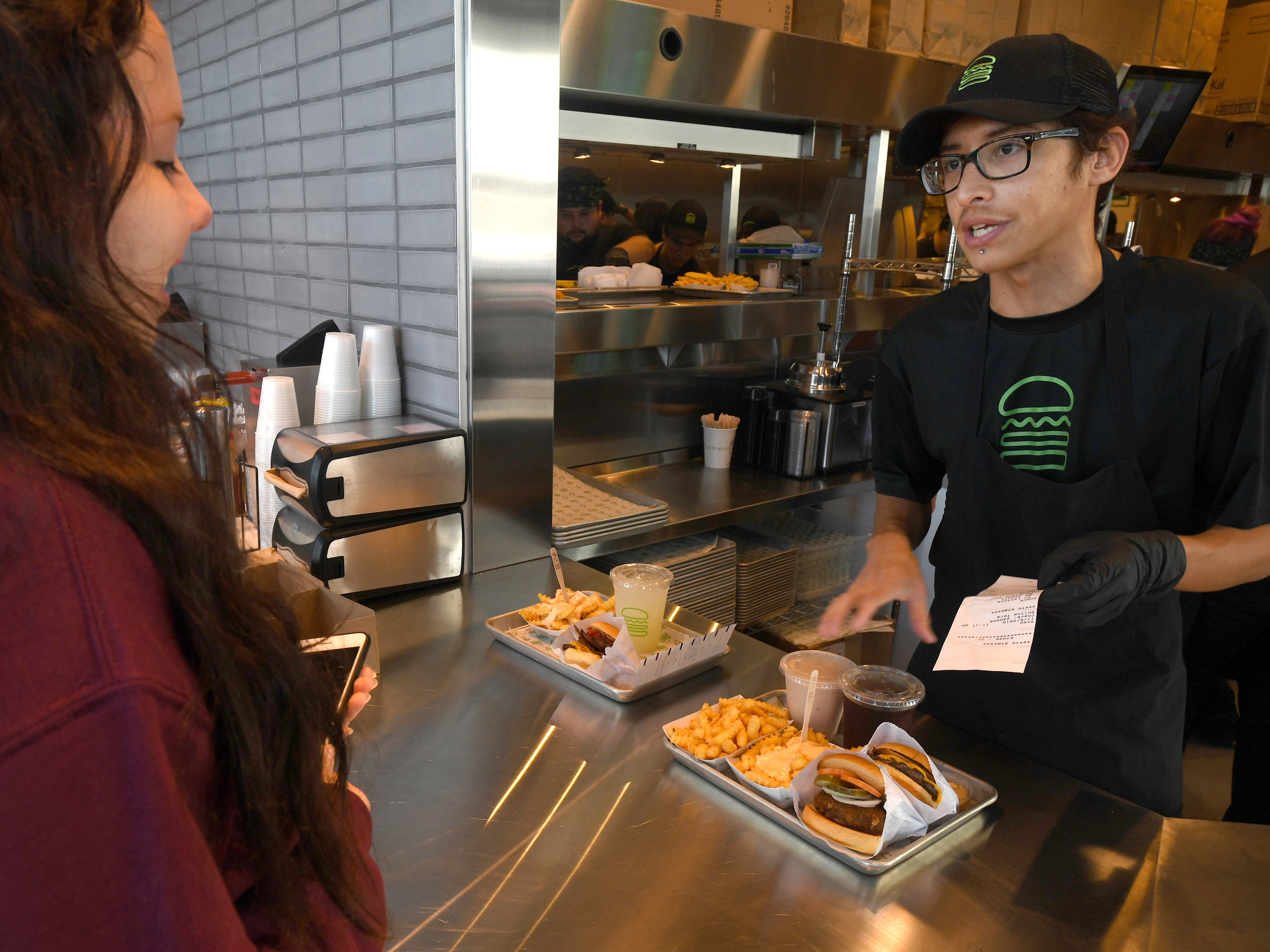 Shake Shack shortened managers' workweeks to four days at some stores a year and a half ago. Recently, the burger chain expanded the trial to a third of its U.S. stores. (MediaNews Group via Getty Images)