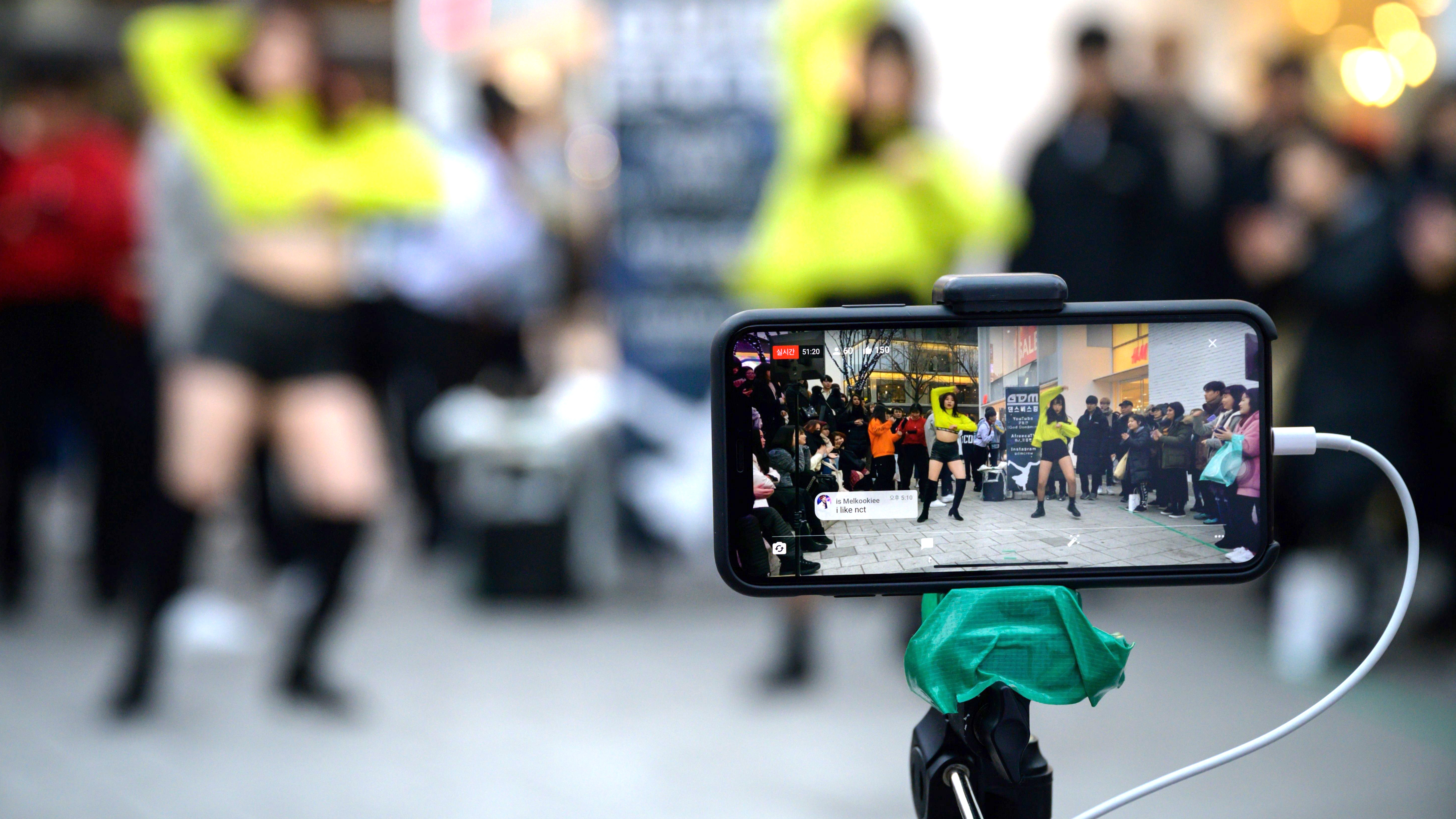 An aspiring K-pop group performs in the Hongdae district of Seoul on Jan. 5, 2020. (AFP via Getty Images)
