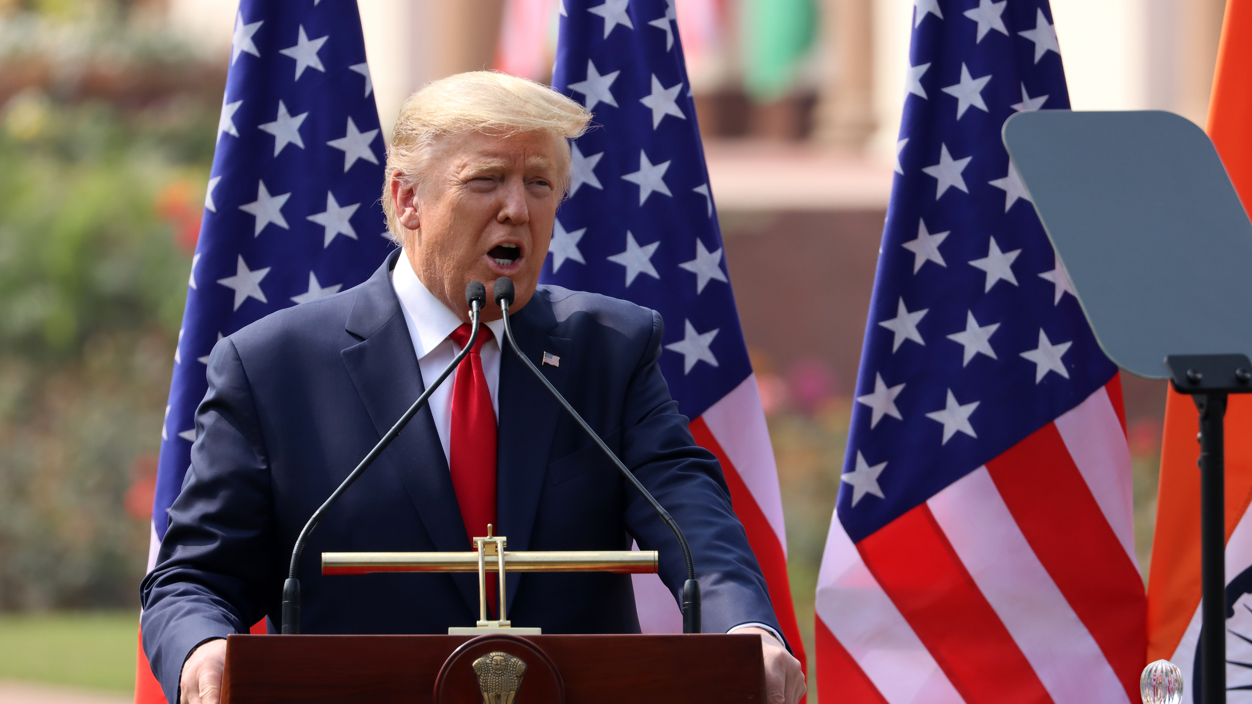 President Trump, pictured in New Delhi on Tuesday, will hold a news conference on Wednesday to discuss the threat of coronavirus. (Bloomberg via Getty Images)