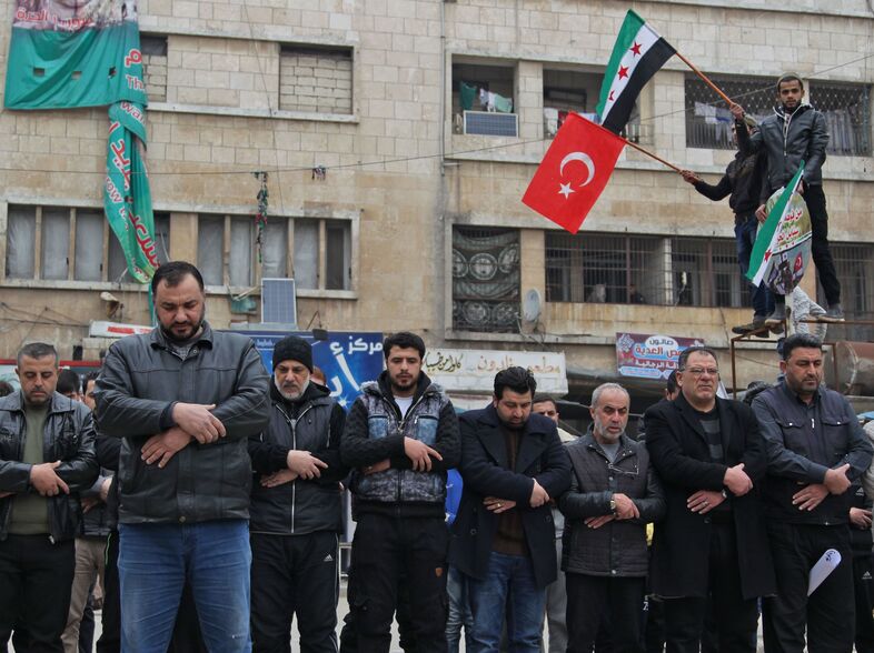 Syrians in the northwestern city of Idlib perform funerary prayers for Turkish soldiers Friday. Turkey sought an urgent NATO meeting after at least 33 Turkish soldiers were killed in Syria's Idlib province Thursday. (Abdulaziz Ketaz/AFP via Getty Images)