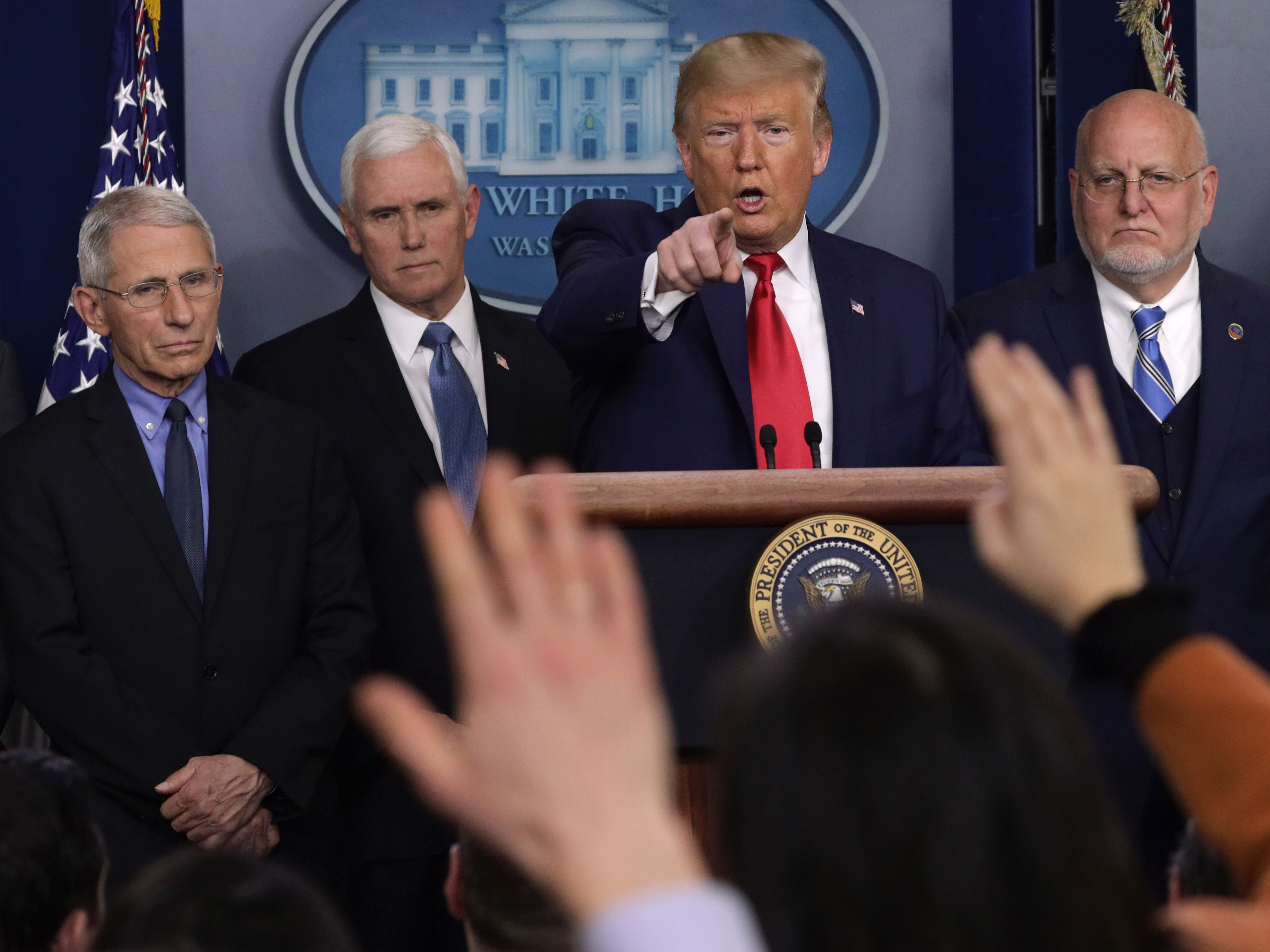 President Trump takes questions at a press conference with, from left, National Institute for Allergy and Infectious Diseases Director Anthony Fauci, Vice President Mike Pence and Centers for Disease Control and Prevention Director Robert Redfield. (Getty Images)