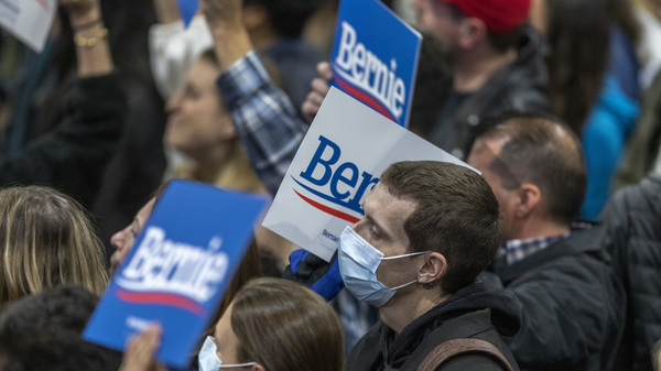 Supporters wear medical masks, as fears of coronavirus increase in California, during a campaign rally for Presidential candidate Sen. Bernie Sanders in Los Angeles on March 1, 2020.