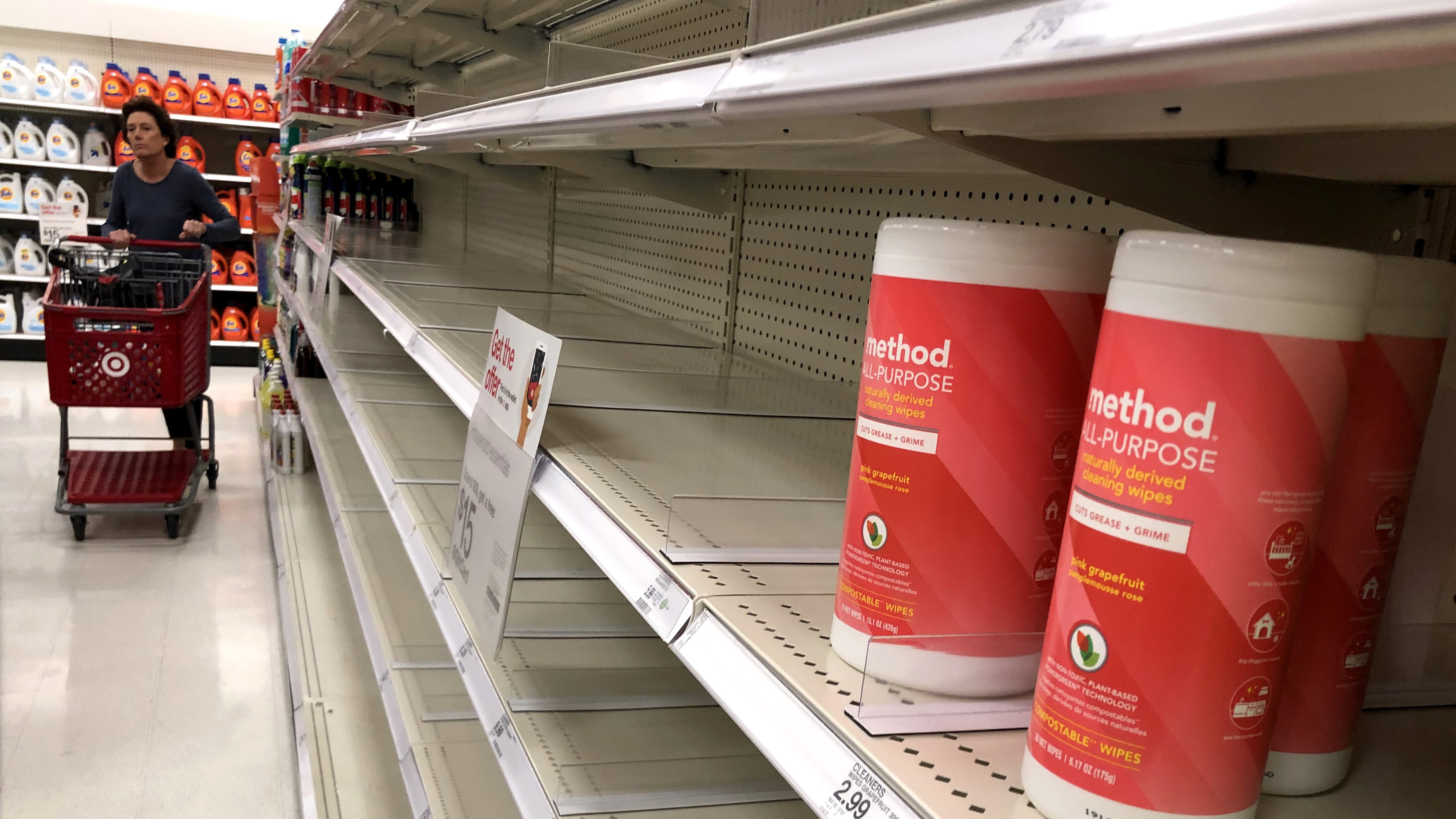 California now has at least 29  cases of the coronavirus that causes COVID-19. Here, shelves of disinfectant wipes are nearly empty at a Target store in Novato, Calif., earlier this week, as fears of the virus prompted shoppers to stock up on sanitizing options.