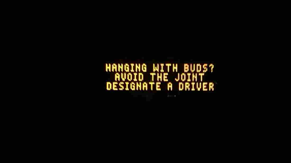 Highway sign that reads "Hanging with buds? Avoid the joint, designate a driver."