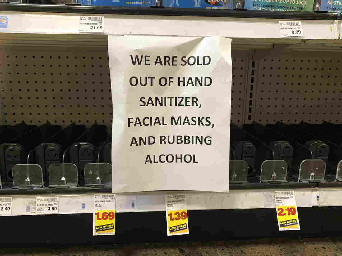 A sign advising out-of-stock sanitizer, facial masks and rubbing alcohol is seen at a store following warnings about COVID-19 in Kirkland, Washington on March 5, 2020.