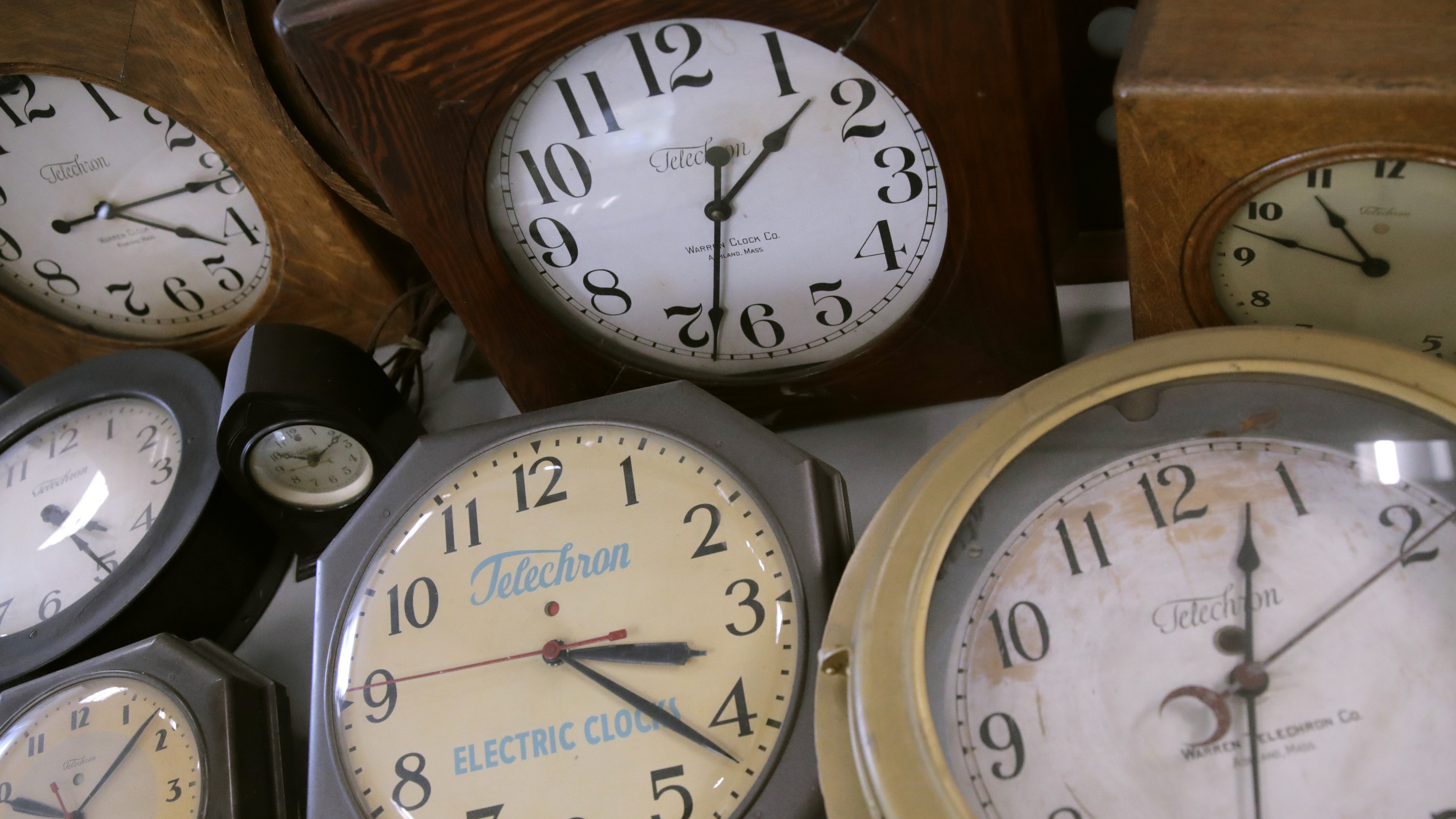 In this March 5, 2020, photo, antique clocks are displayed at the Electric Time Company, in Medfield, Mass. Daylight Saving Time returns Sunday at 2 a.m. local time.