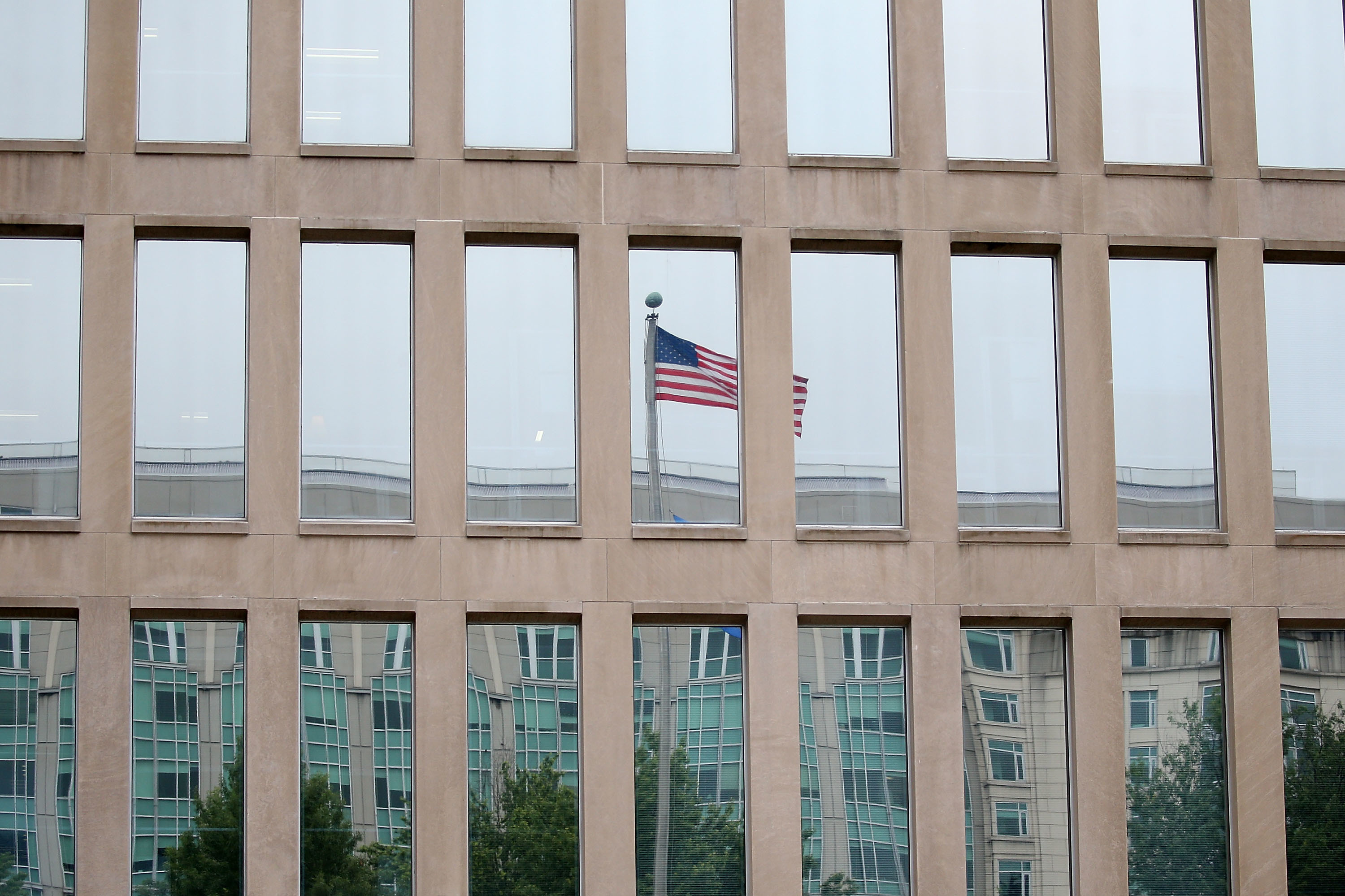 The White House is taking a different view on telework as the Office of Personnel Management, housed in the Theodore Roosevelt Federal Building, tells agencies to incorporate the practice into contingency plans. (Getty Images)