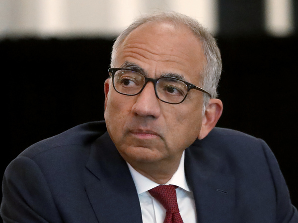 U.S. Soccer President Carlos Cordeiro presides over a meeting of the U.S. Soccer Board of Directors in Chicago in December. Cordeiro resigned Thursday night, three days after the organization filed legal papers in a gender discrimination lawsuit claiming female players had less physical ability and responsibility than men.