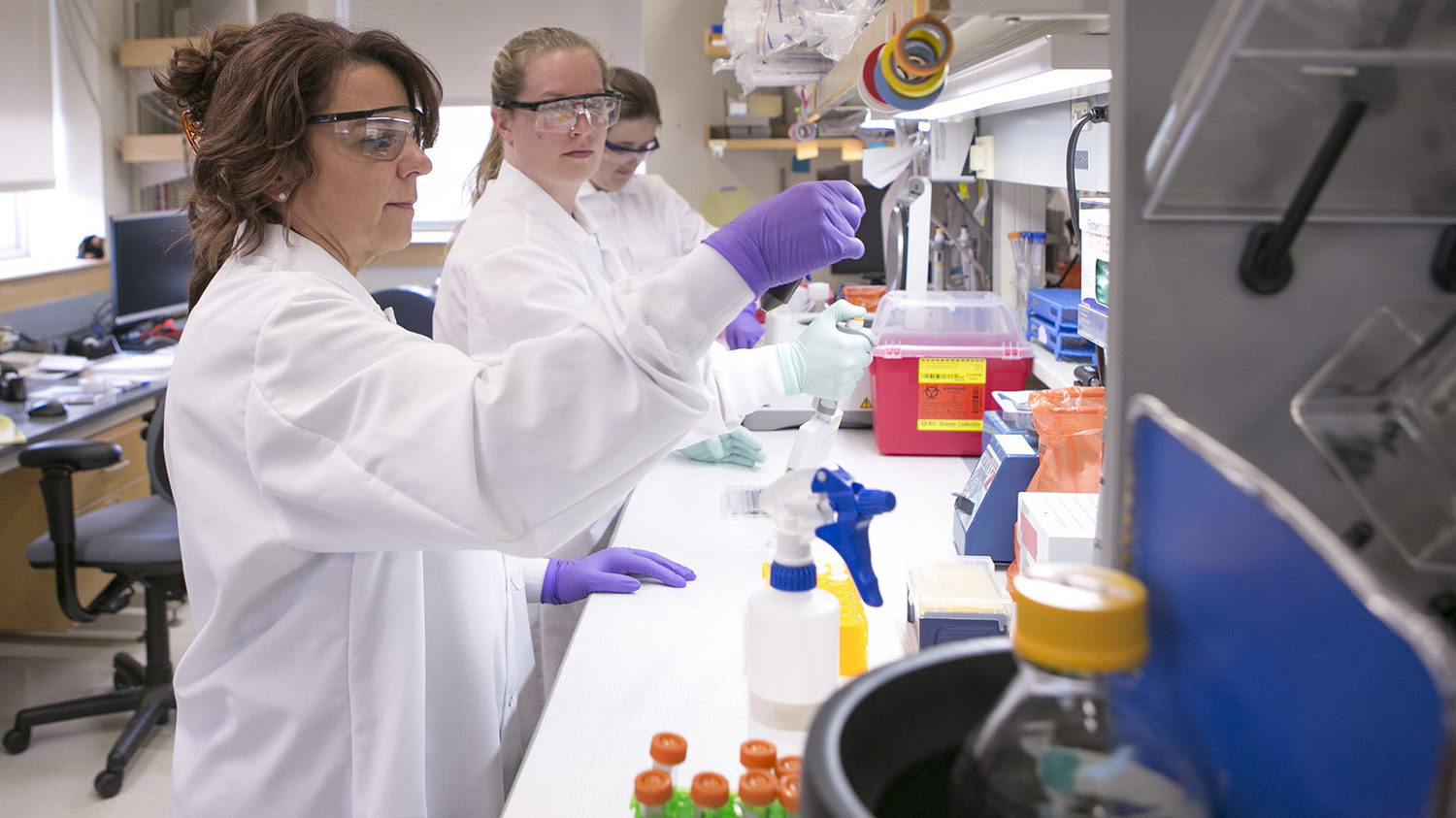 Cat Lutz (far left) in her lab at the Jackson Laboratory Mouse Repository.