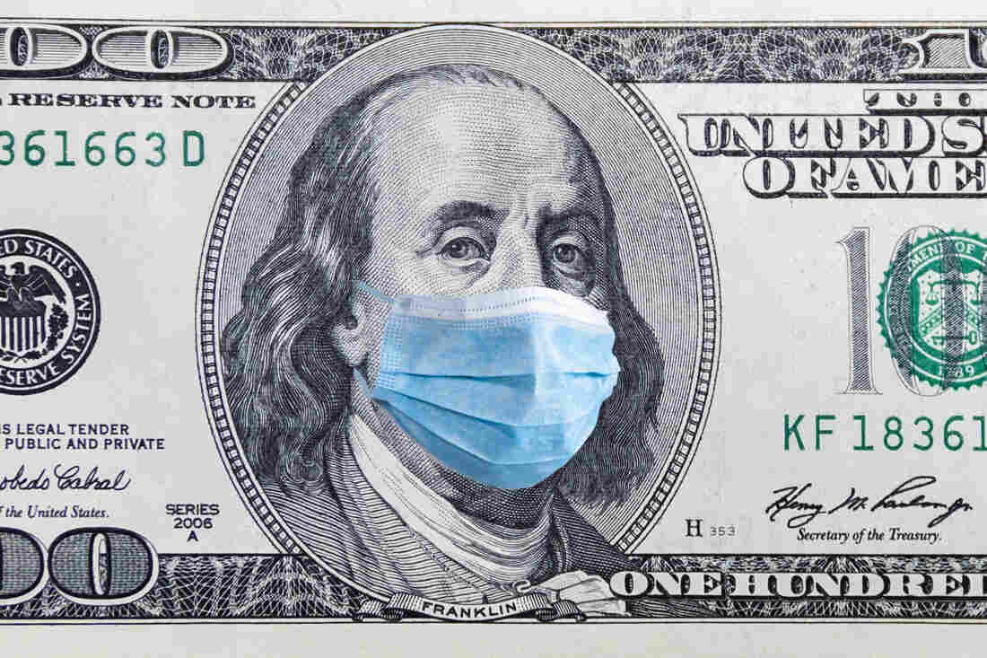 US quarantine, 100 dollar banknote with medical mask.