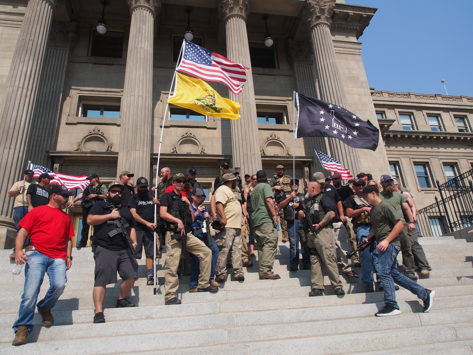 Gun rights supporters, including militia members, rally in support of gun rights in September 2018 during an event put on by the Idaho Second Amendment Alliance. The alliance and groups like it around the country have been pushing back against efforts to increase gun regulations in the wake of high rates of gun violence. (Boise State Public Radio)