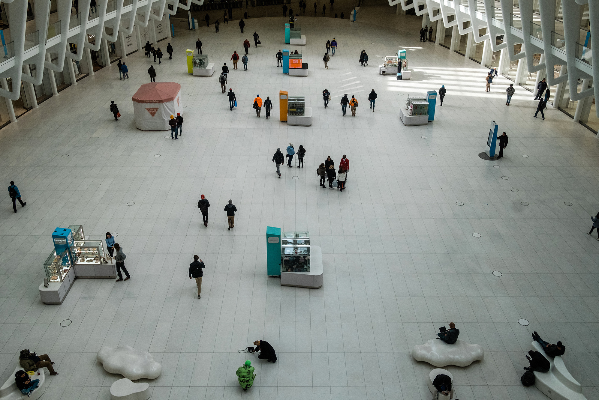 The normally busy transportation hub at the World Trade Center in Manhattan was sparsely populated on Monday. The governors of New York, New Jersey and Connecticut have banned all gatherings of 50 or more people. (Bloomberg via Getty Images)
