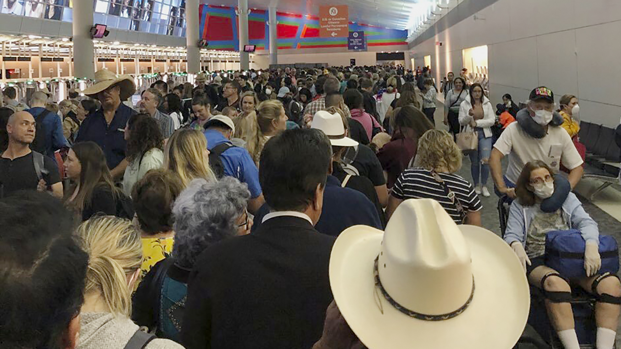 People waited in line to go through the customs at Dallas/Fort Worth International Airport on Saturday as staff took extra precautions to guard against the coronavirus.