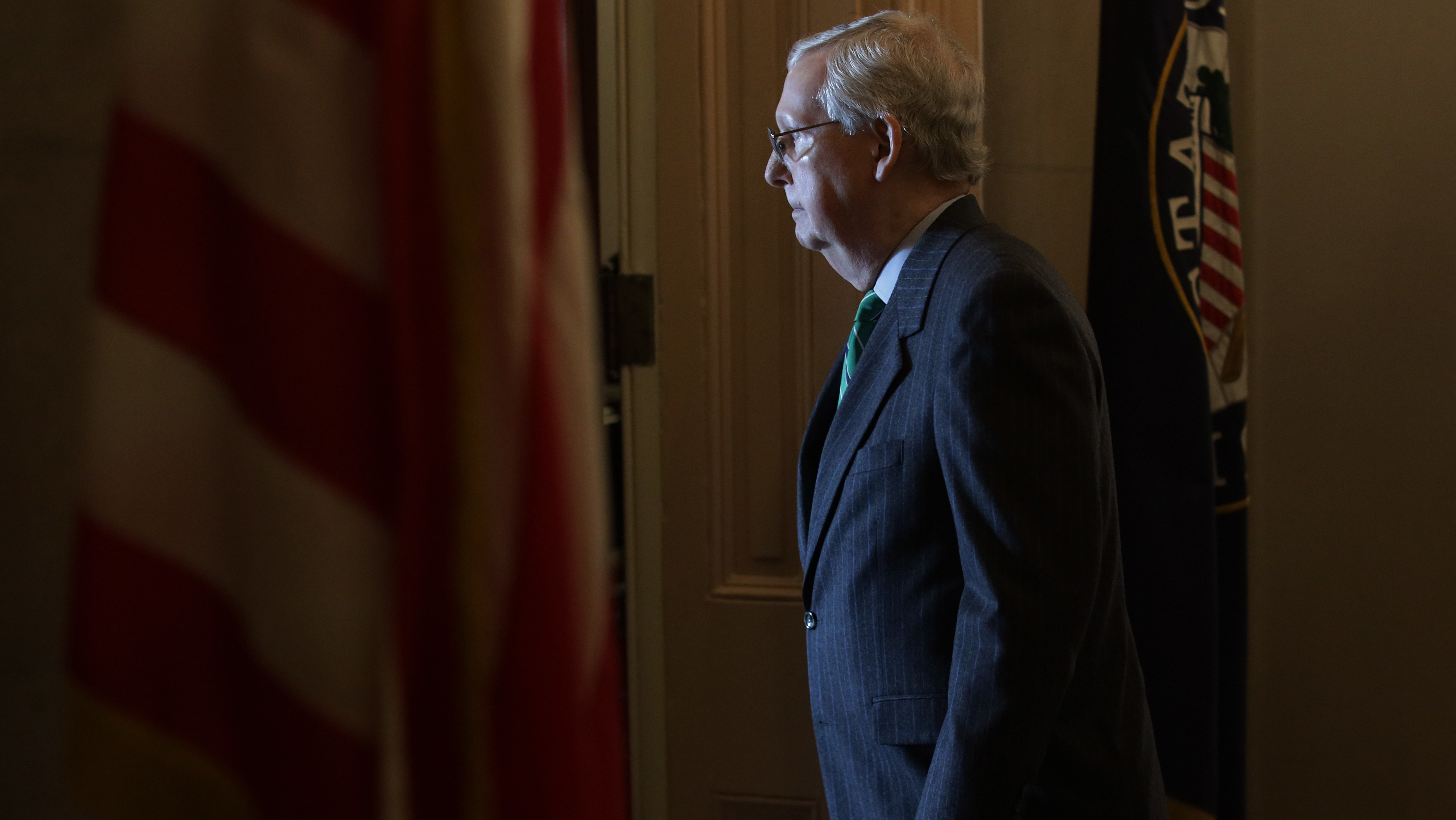 Senate Majority Leader Sen. Mitch McConnell walks into his office after he spoke on the Senate floor Thursday. (Getty Images)