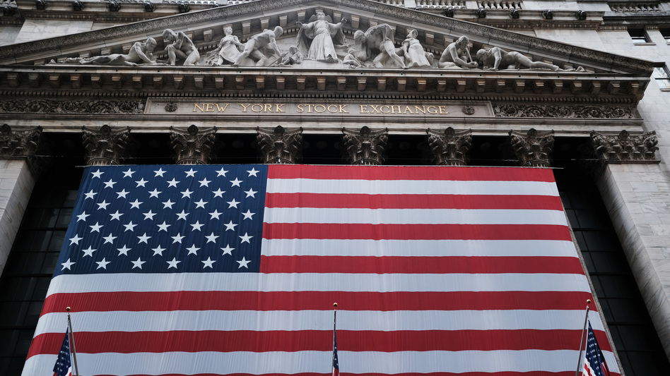 Stocks fell again Monday as U.S. lawmakers continued to work on a massive stimulus measure. The floor of the New York Stock Exchange was closed as the exchange shifted to all-electronic trading amid the coronavirus outbreak. (Spencer Platt/Getty Images)