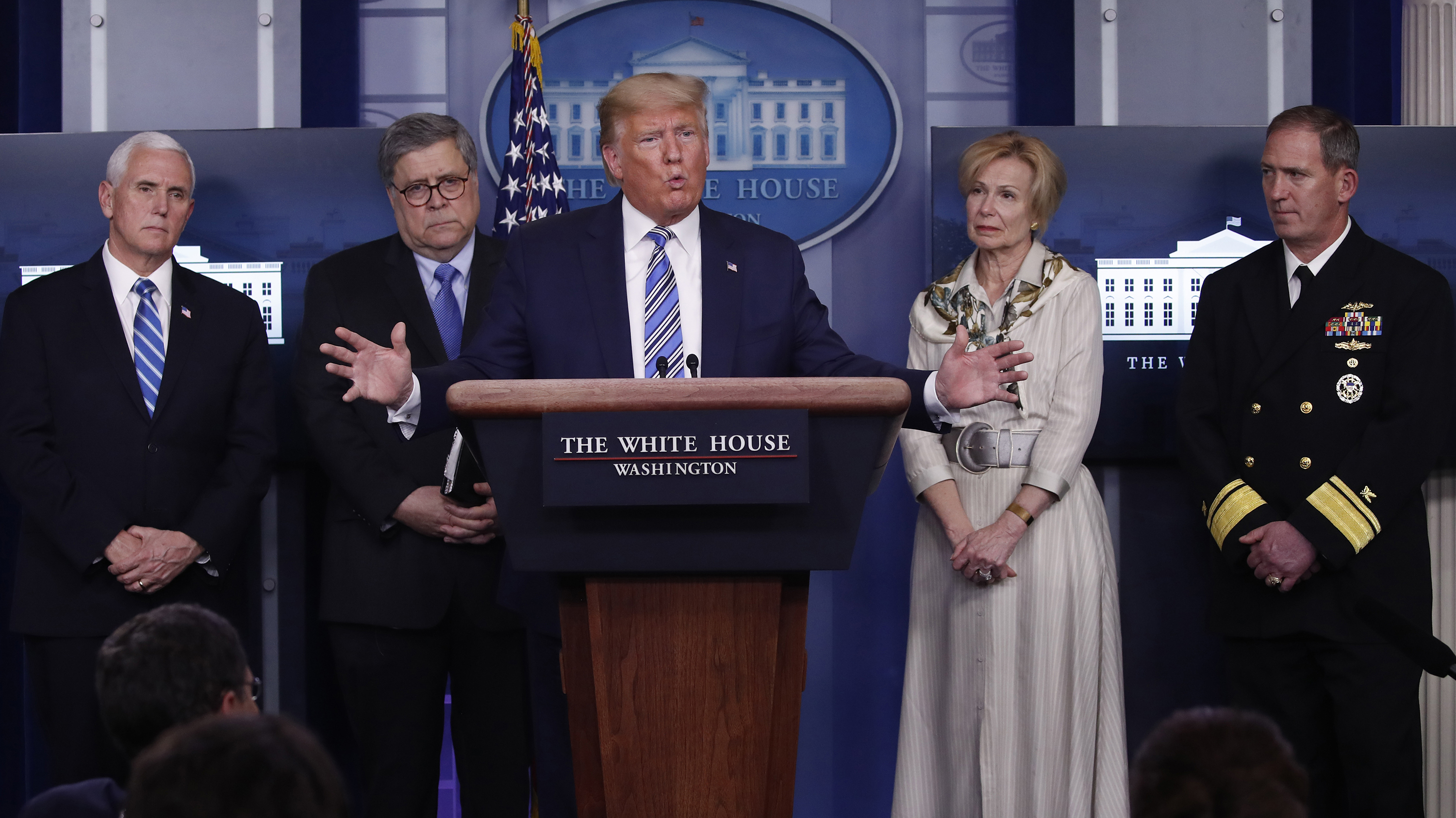 President Donald Trump takes questions from reporters Monday at his press briefing on coronavirus in Washington. Listening from left are Vice President Mike Pence; Attorney General William Barr; Dr. Deborah Birx, White House coronavirus response coordinator; and Navy Rear Adm. John Polowczyk, who leads FEMA