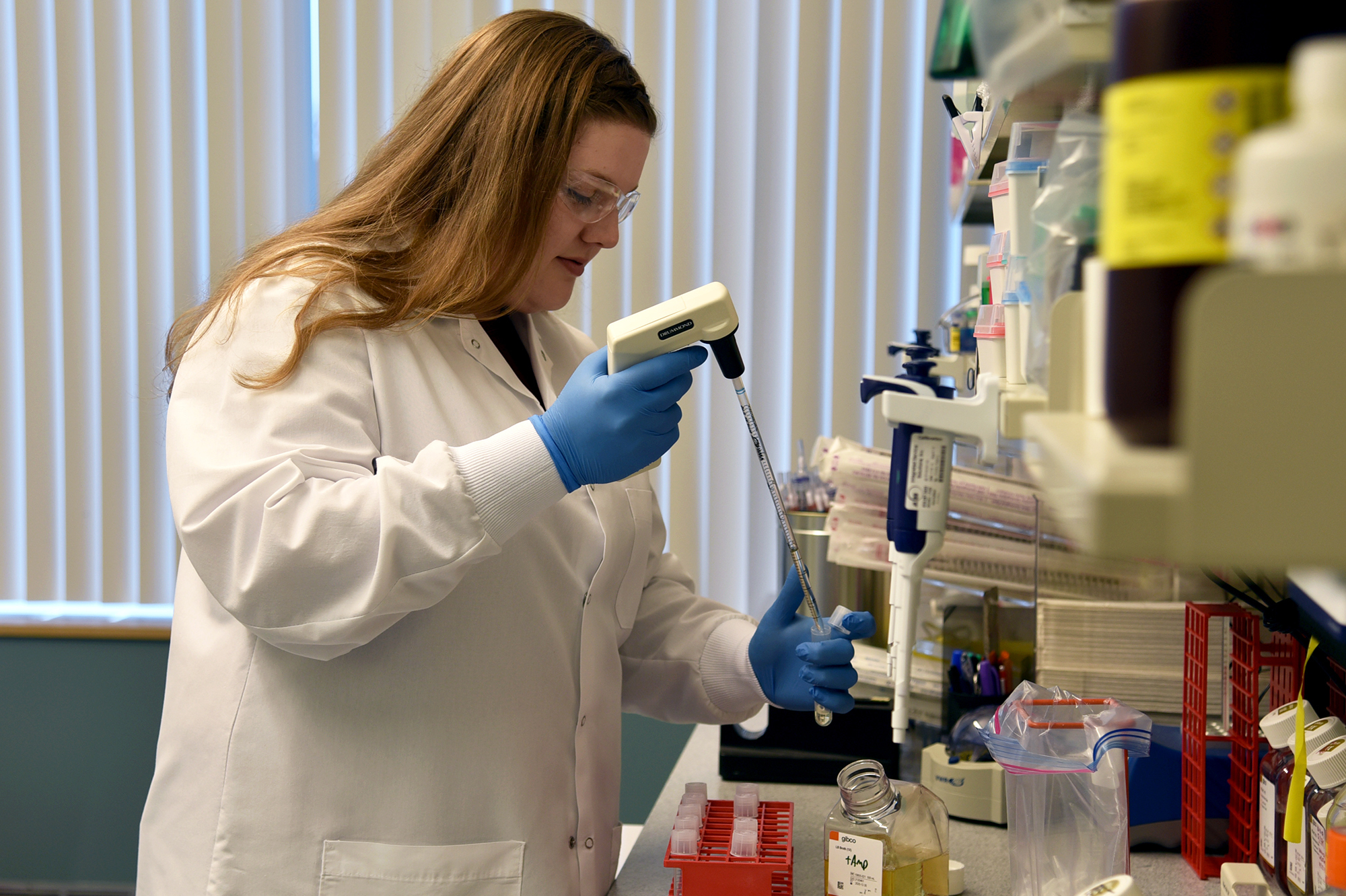 Regeneron Pharmaceuticals, headquartered near Tarrytown, N.Y., is just one of the companies now working to identify and reproduce large quantities of antibodies that could prevent or treat COVID-19. Senior R&D Specialist Kristen Pascal works on COVID-19 research for Regeneron. (Rani Levy/Regeneron Pharmaceuticals)