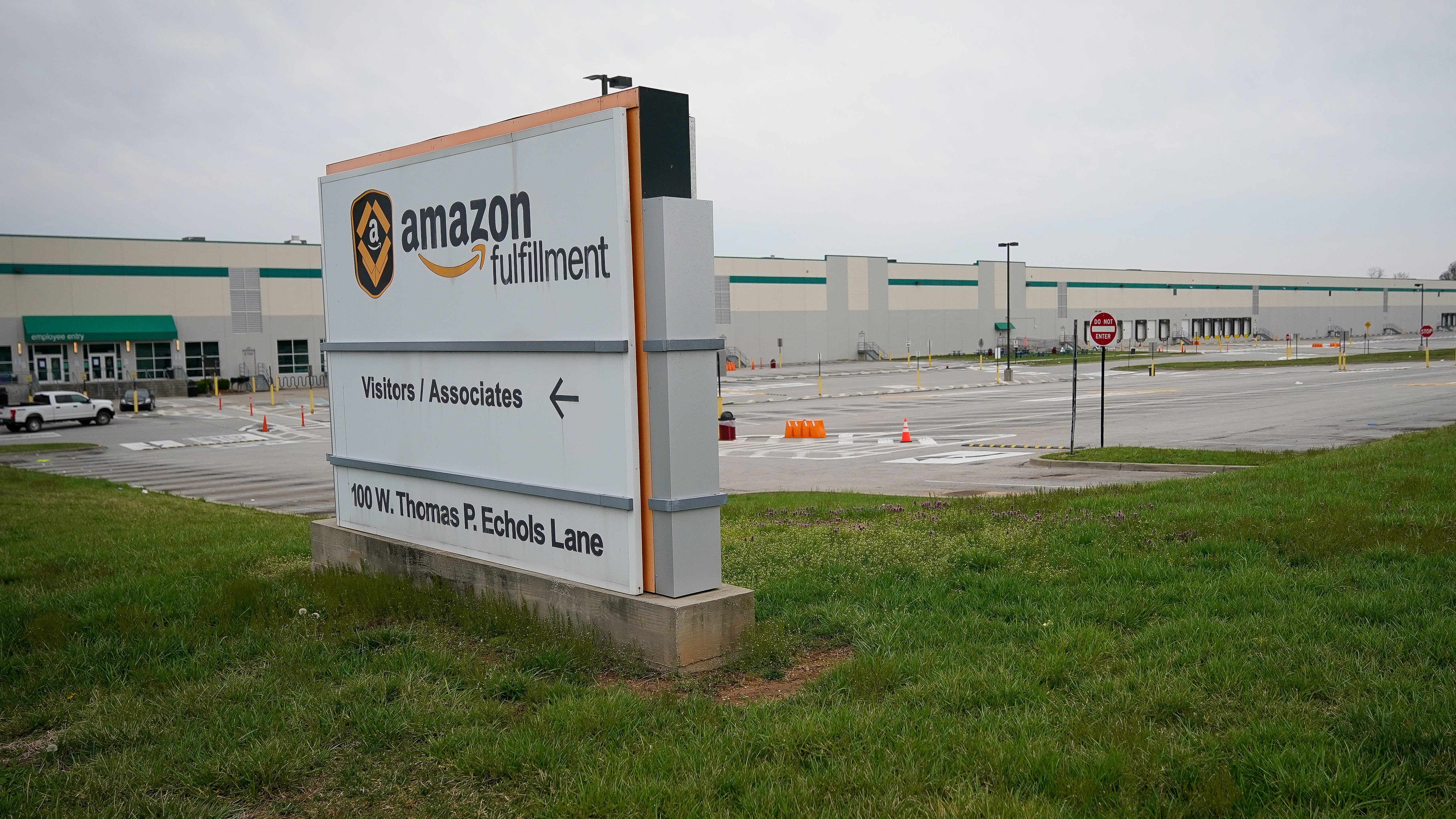 Empty parking lots surround an Amazon distribution center in Shepherdsville, Ky., that has been closed for cleaning after several employees tested positive for COVID-19. (Reuters)