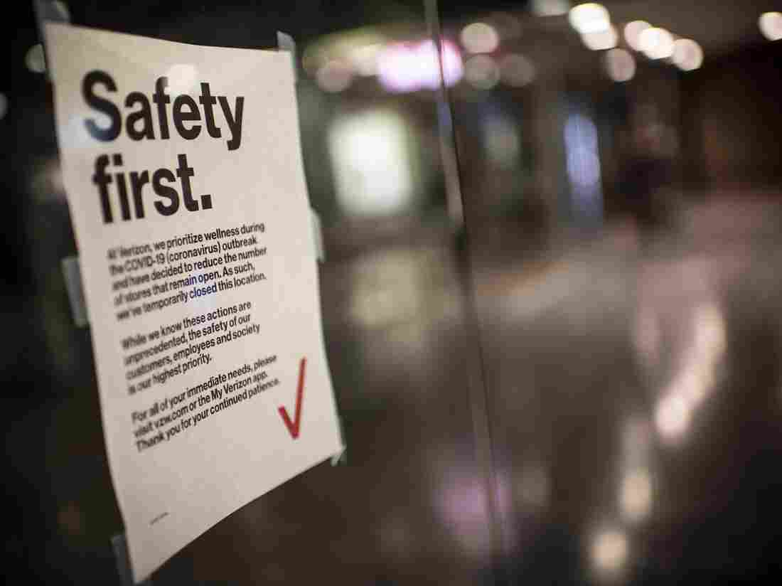 A sign warning of the Covid-19 coronavirus is displayed in the corridors of Union Station as the US Capital train station is almost deserted by commuters during the 6pm usual rush hour in Washington on March 25, 2020.