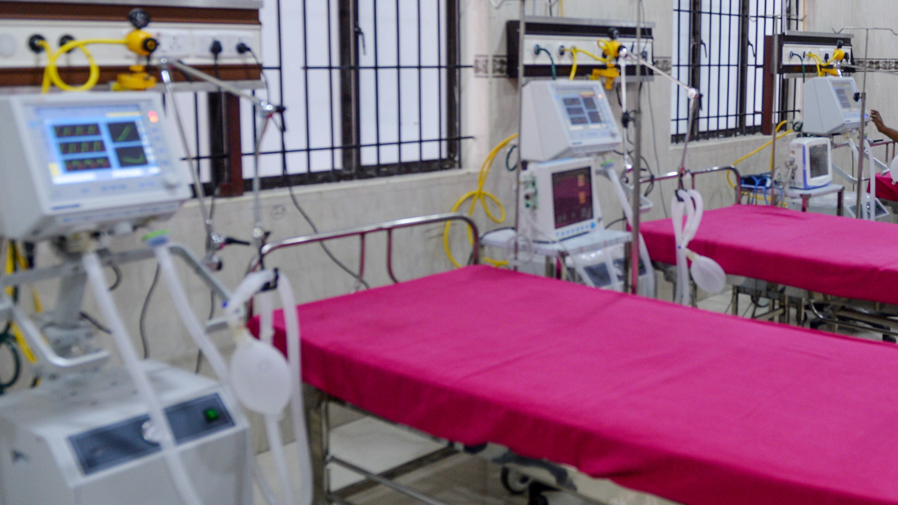 A staffer checks on a ventilator in an intensive care unit in Chennai, India, Friday. States in the U.S. are coming up with plans for what to do if they run out of ventilators and other supplies.