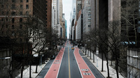 In New York City, 42nd Street stands mostly empty as much of the city is void of cars and pedestrians over fears of spreading the coronavirus.