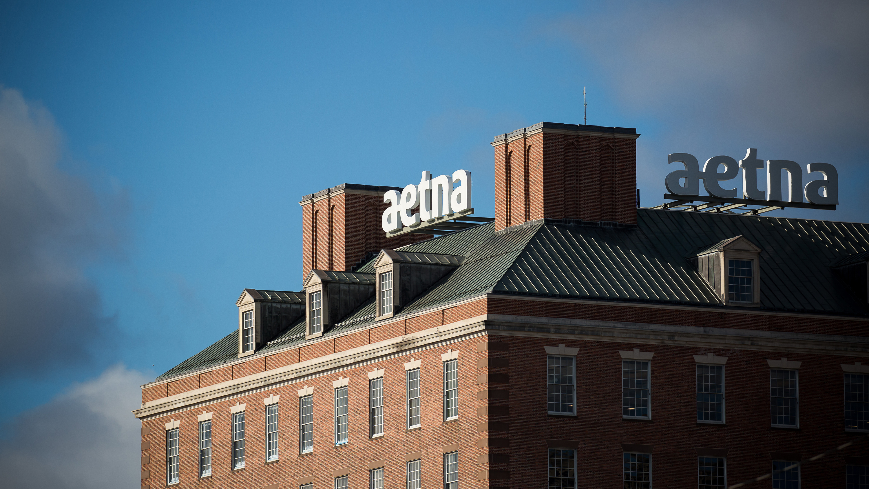 Aetna was the first insurer to announce its plan to help shield patients with COVID-19 from high medical bills. But out-of-network charges and other surprise bills remain a risk, say advocates for patients.