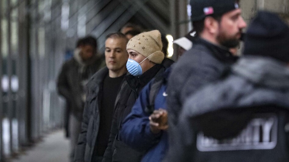 People waiting outside a supermarket comply with citywide social distancing restrictions in New York City earlier this month. (Bebeto Matthews/AP)