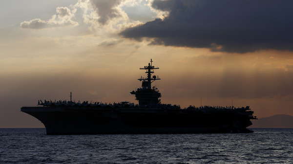 The aircraft carrier USS Theodore Roosevelt aircraft carrier anchored off Manila Bay west of Manila, Philippines, in a photo from 2018.