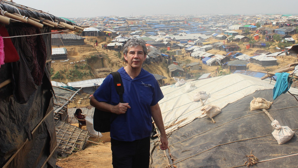 Trauma surgeon David Nott, shown above in Bangladesh, has volunteered in war zones and disaster areas around the world. Now he's treating COVID-19 patients in London. (David Nott Foundation)