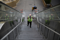 A worker cleans an area along the Las Vegas Strip that's now devoid of the usual crowds, with casinos and many other business shuttered.
