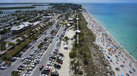 Englewood Beach in Charlotte County, Fla., was crowded on March 20. Public gatherings like these will be prohibited in Florida beginning Thursday.