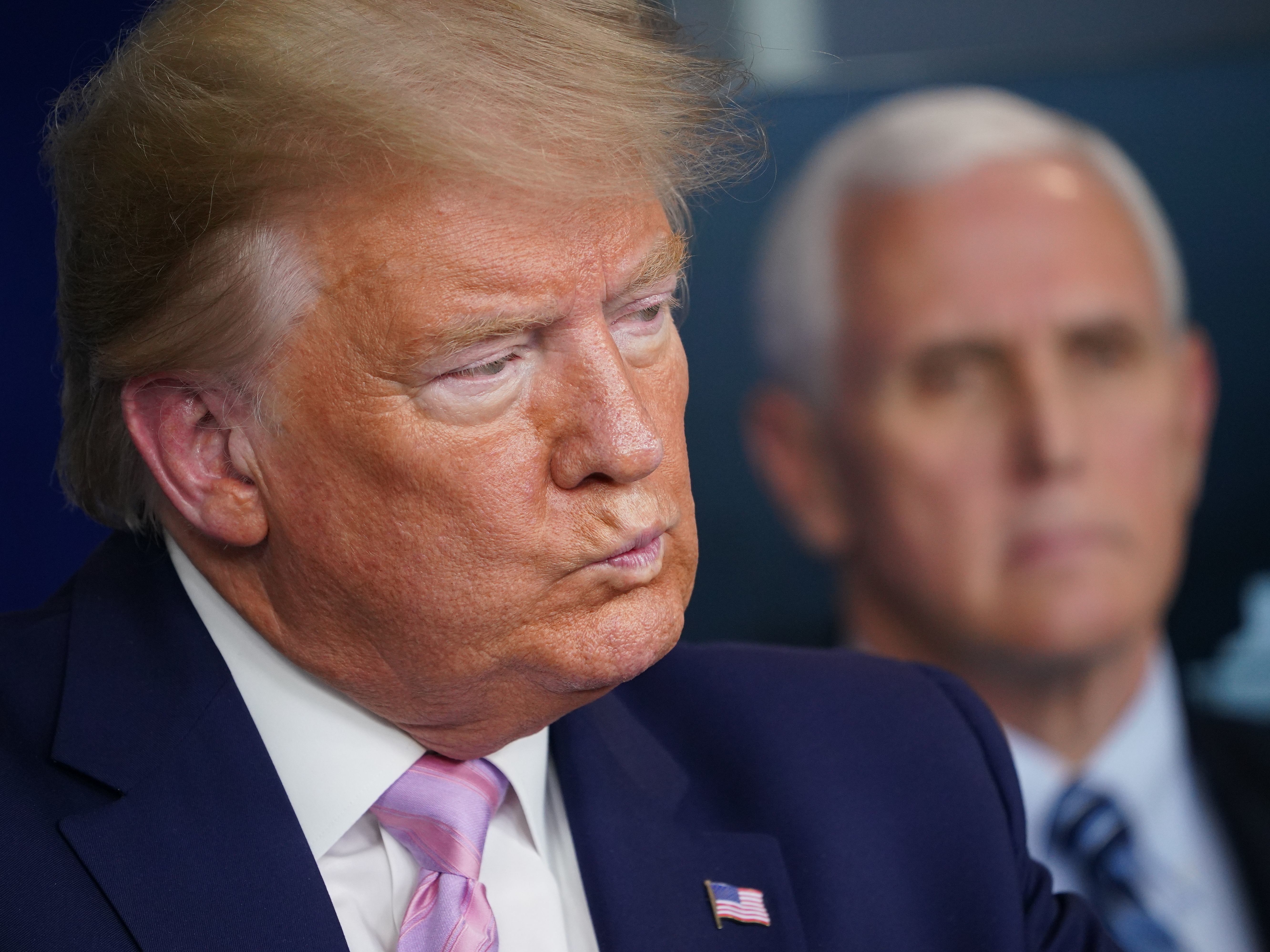 President Trump listens during Wednesday's press briefing with the White House coronavirus task force.