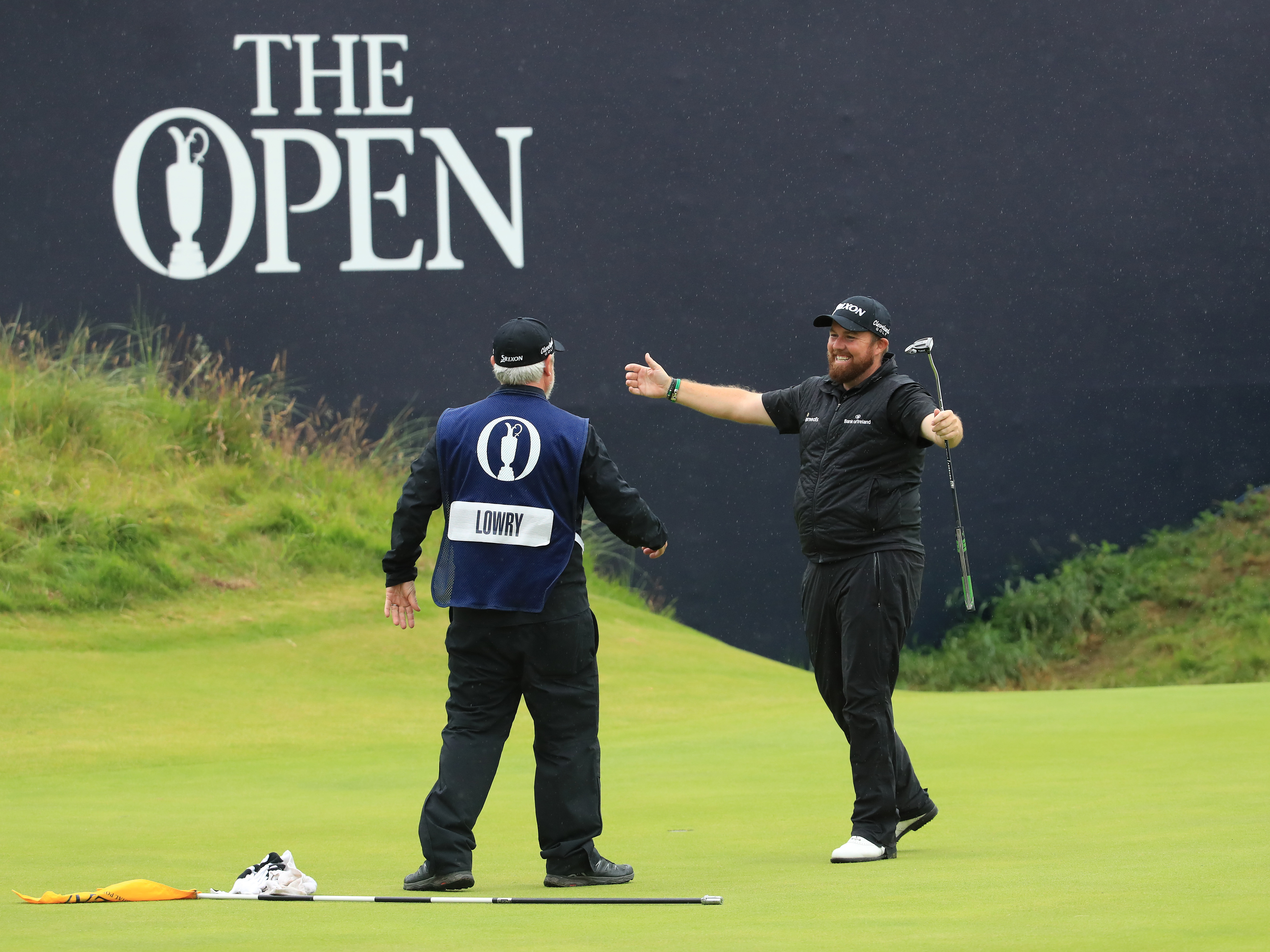 The British Open, which is golf's oldest tournament, has been canceled this year because of the coronavirus. Last year, Shane Lowry (right) celebrated winning that championship. (Getty Images)